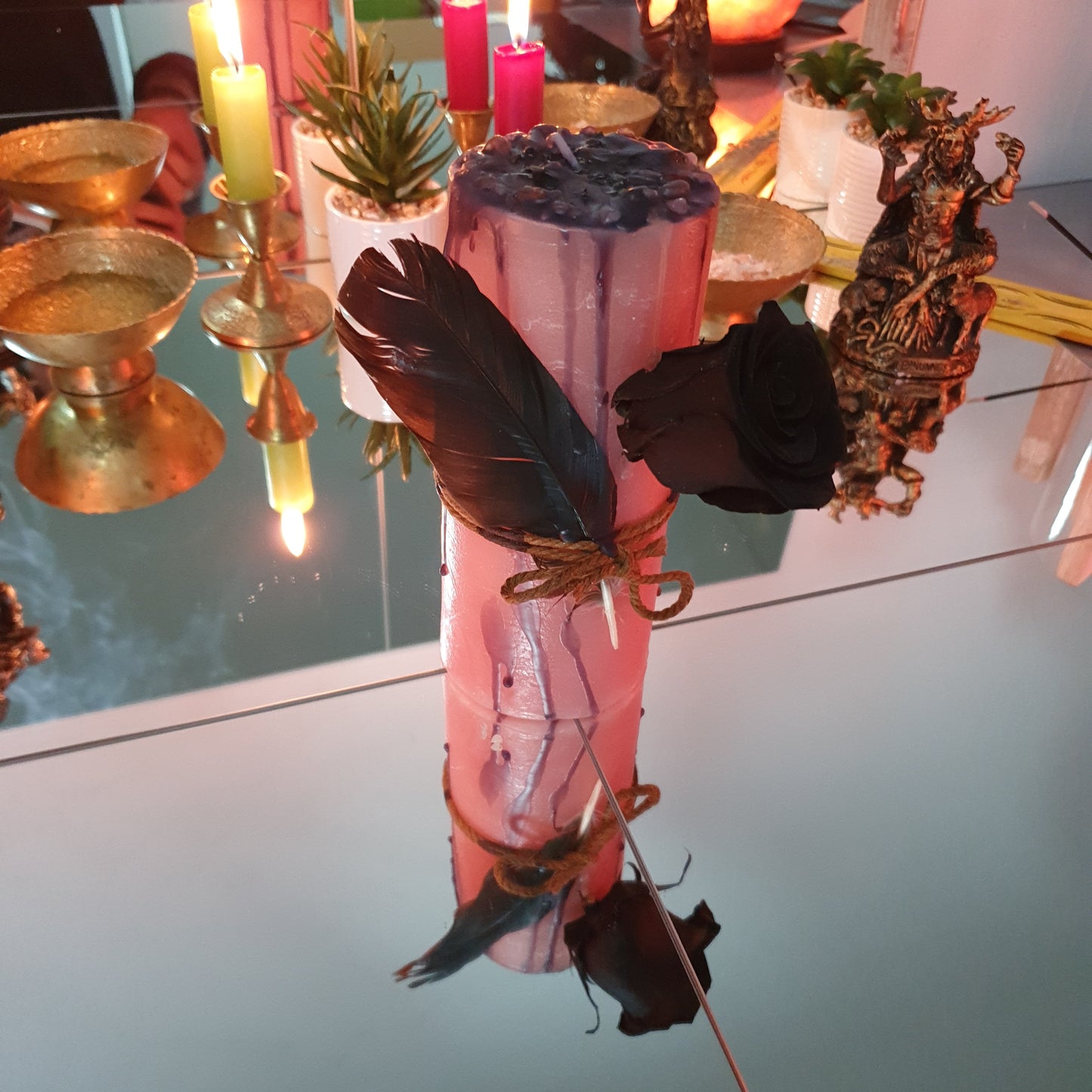 Feather and rose candle for self-love