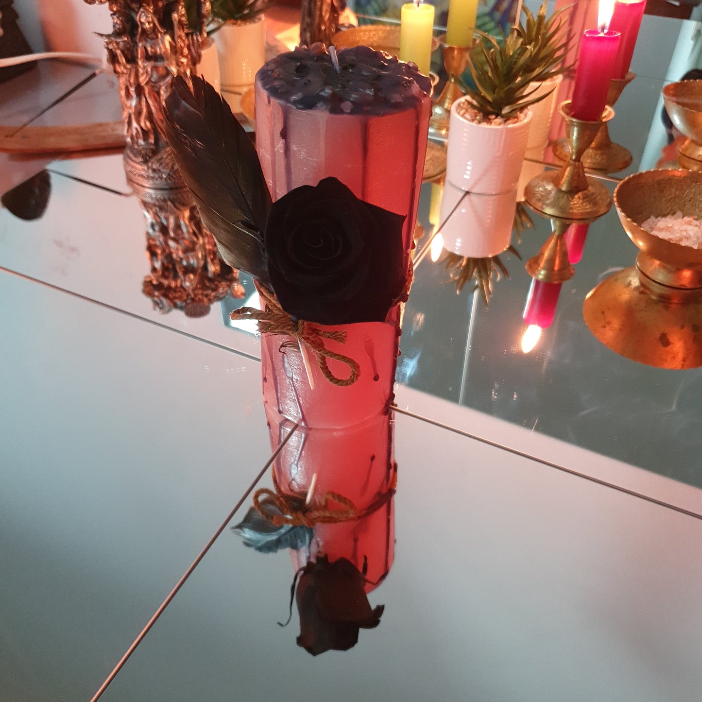 Feather and rose candle for self-love