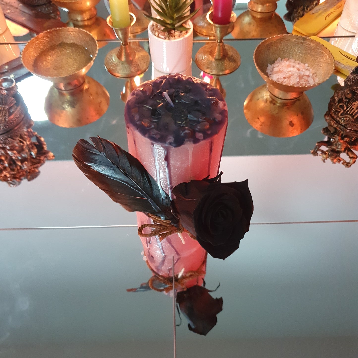 Feather and rose candle for self-love